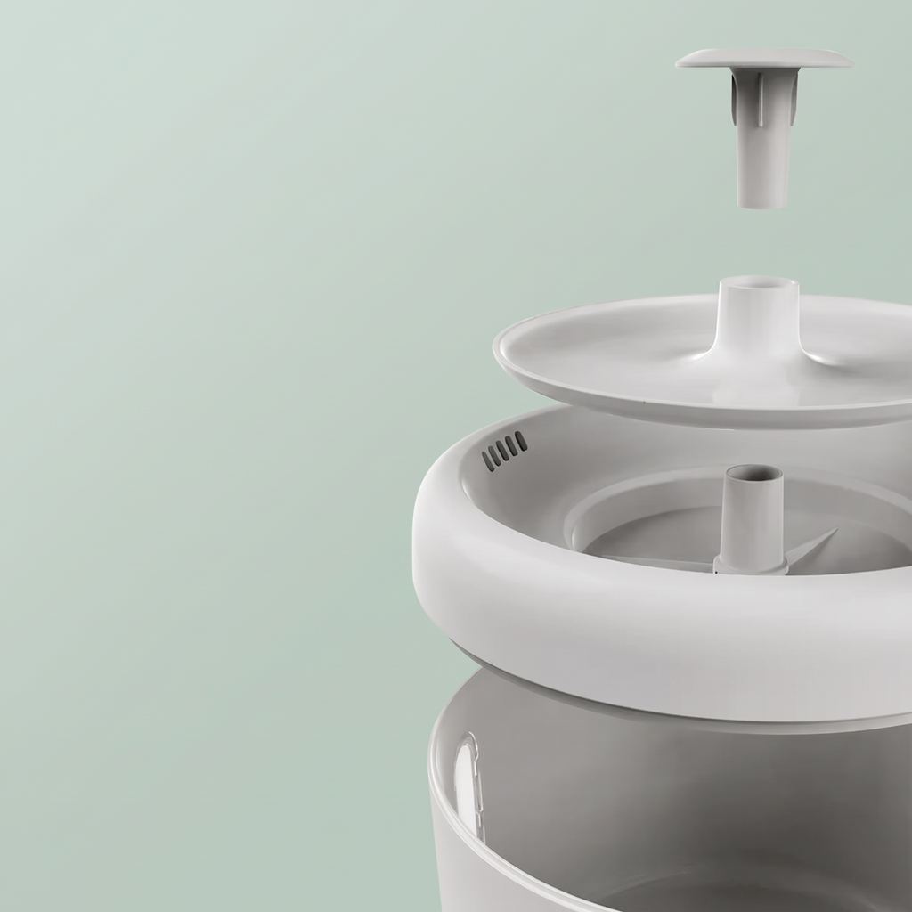 Exploded view of the pet water fountain showing lid, spout and pump for easy cleaning